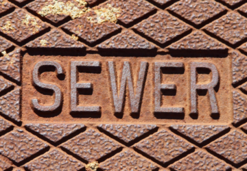 a sewer manhole cover representing the issues around wastewater in suburban Adelaide.